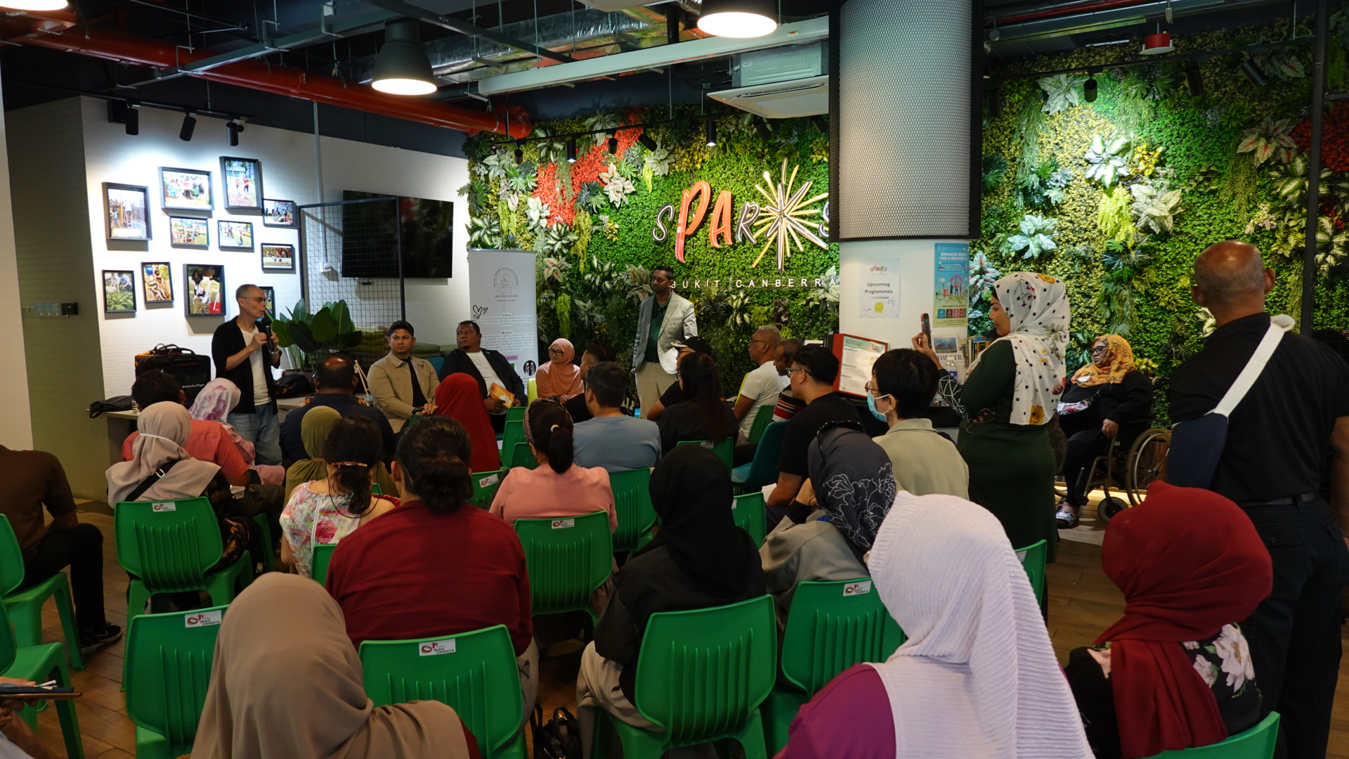 Image of people listening to a speaker